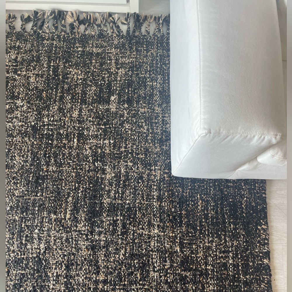 9x12rug made of wool . Shades of brown and black almost new